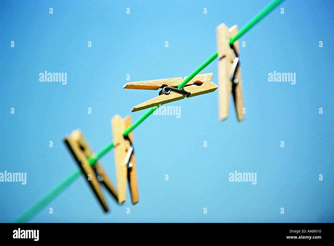 Clothes pegs on a washing line Stock Photo