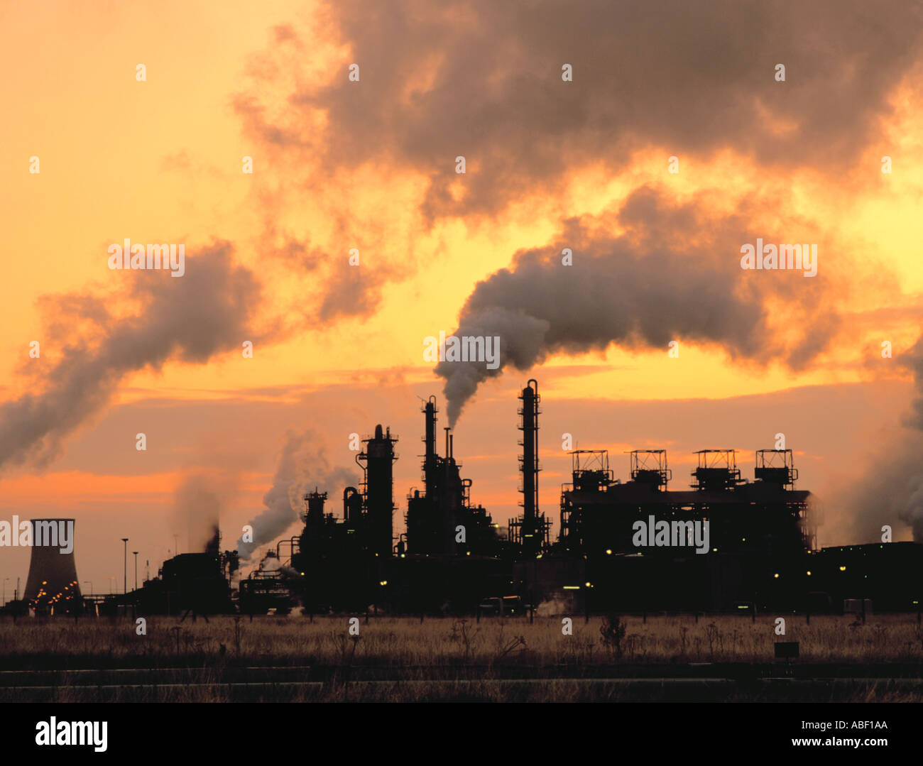 Chemical works against a yellow sunset; Part of the chemical complex at Wilton, Teesside, Cleveland, England, UK. Stock Photo