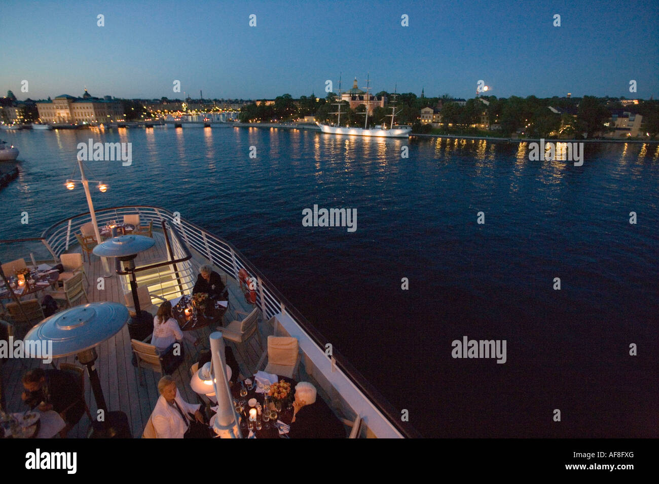 Dining on Lido Deck at Dusk, Europa's Beste 2006 Culinary Event, aboard MS Europa, Stockholm, Sweden Stock Photo