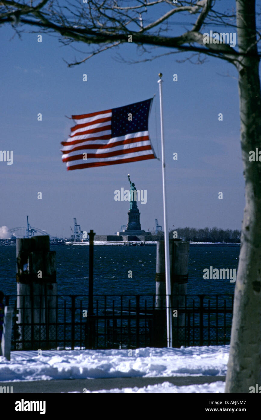 American flag and Statue of Liberty New York City USA Stock Photo