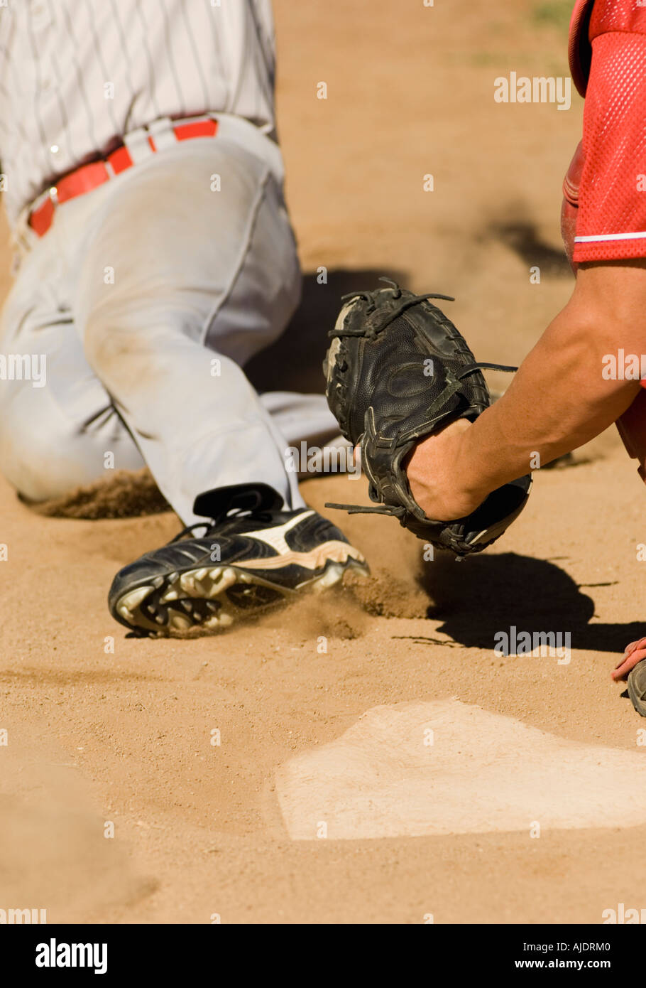 Baseball players at home base, (close-up) Stock Photo