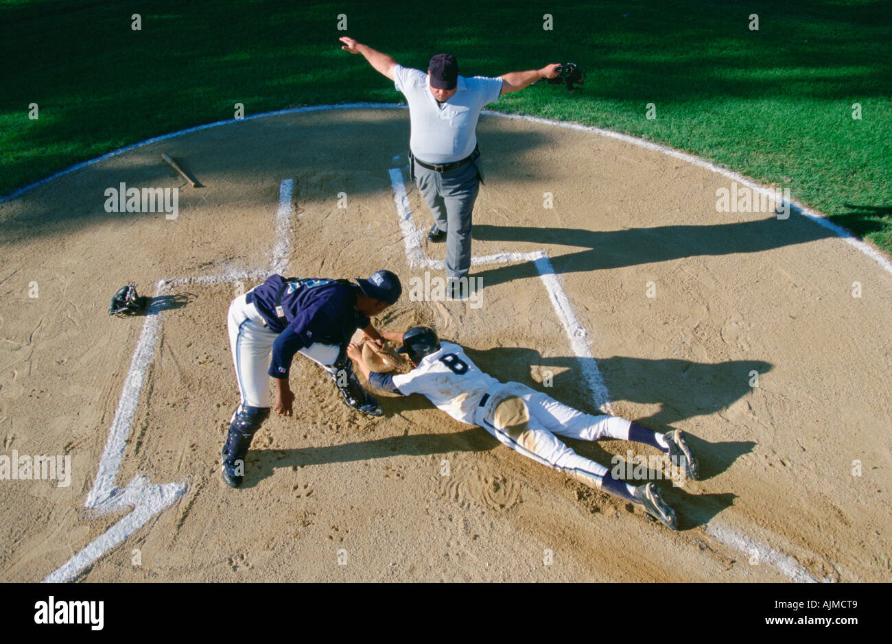 Slinding into home plate Stock Photo