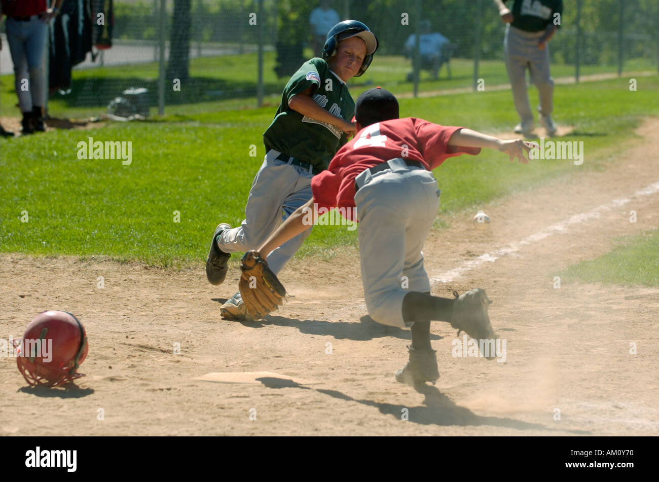 Baseball player sliding into home plate Stock Photo