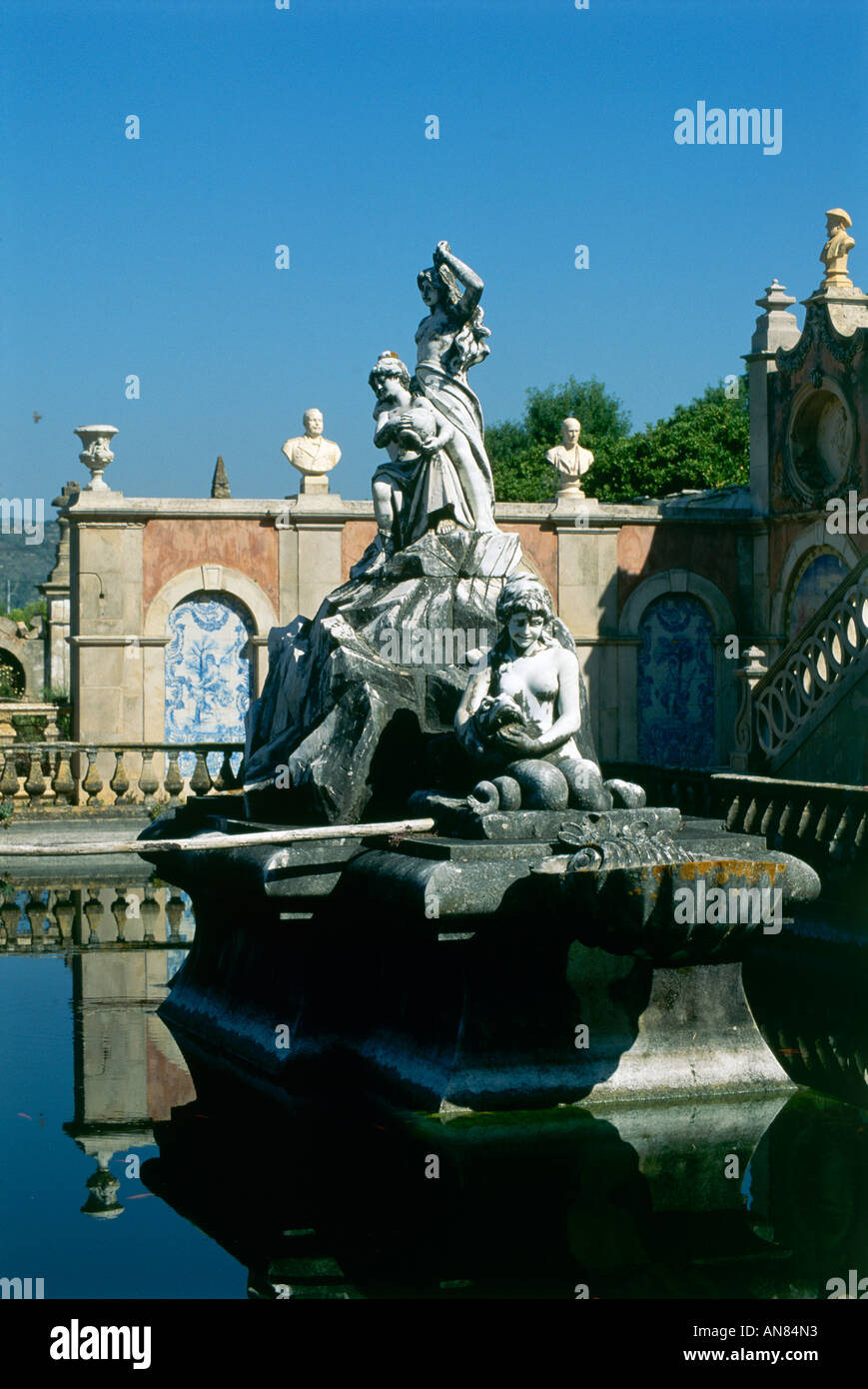 All about the grounds of the 18th century Palacio de Estoi are fine sculptures and decoration note the busts and tiles beyond this statue Stock Photo