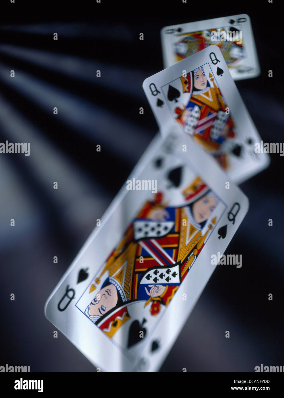 Falling queen of spades cards Stock Photo