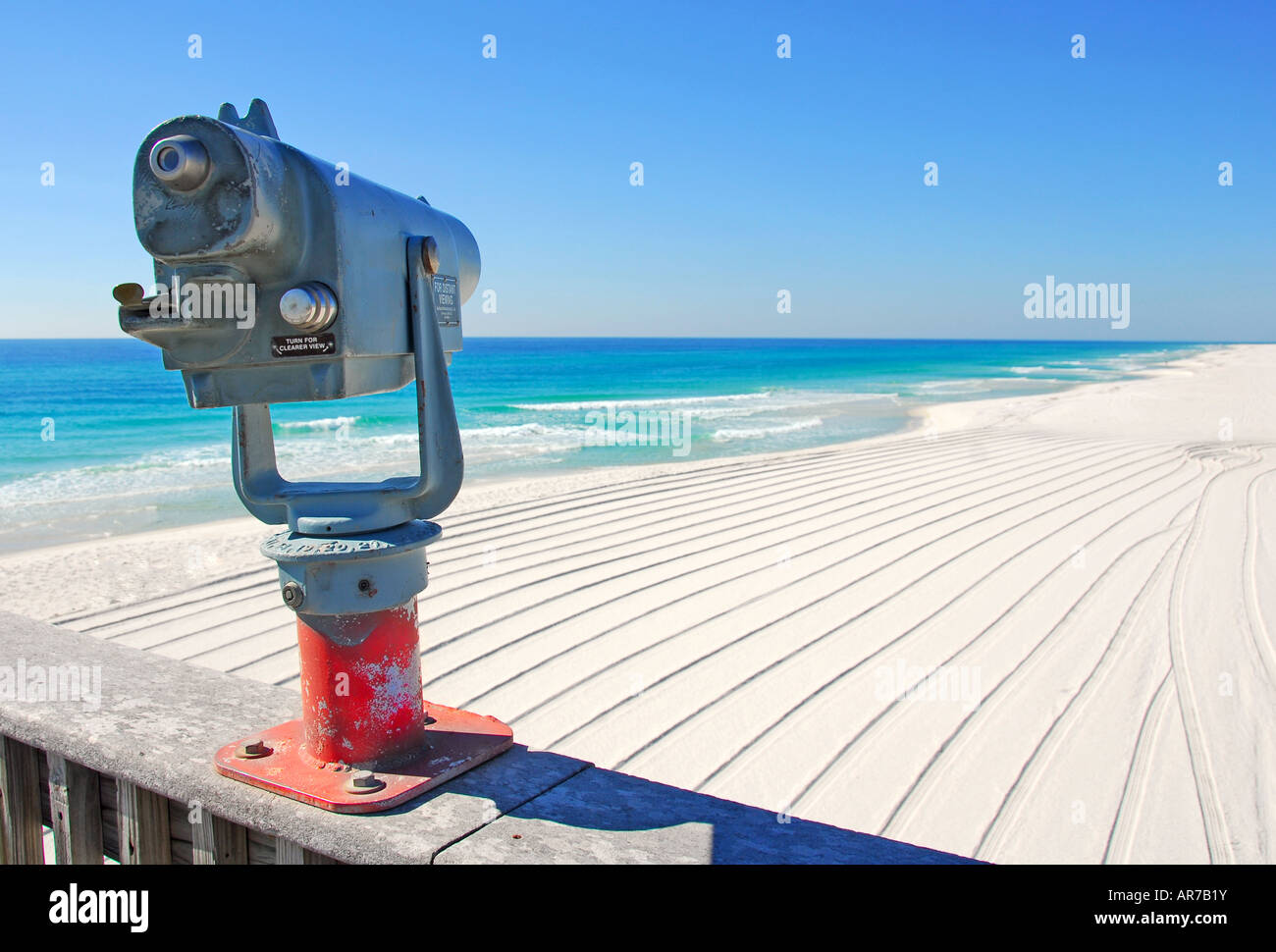 Viewfinder on pier overlooking beautiful beach Stock Photo