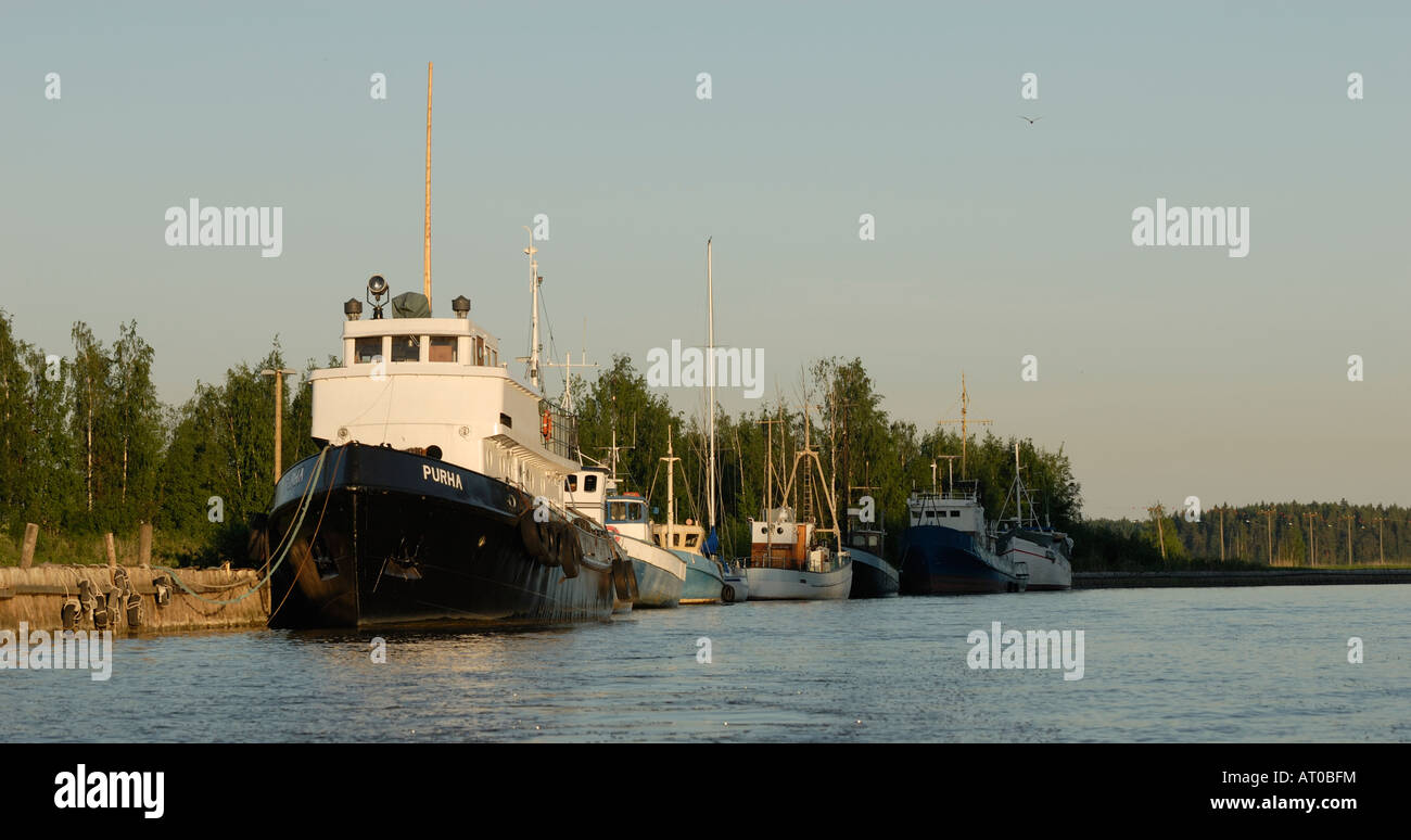 The fishing boats berthed along the Porvoo river at sunset, Porvoo, Finland, Europe. Stock Photo