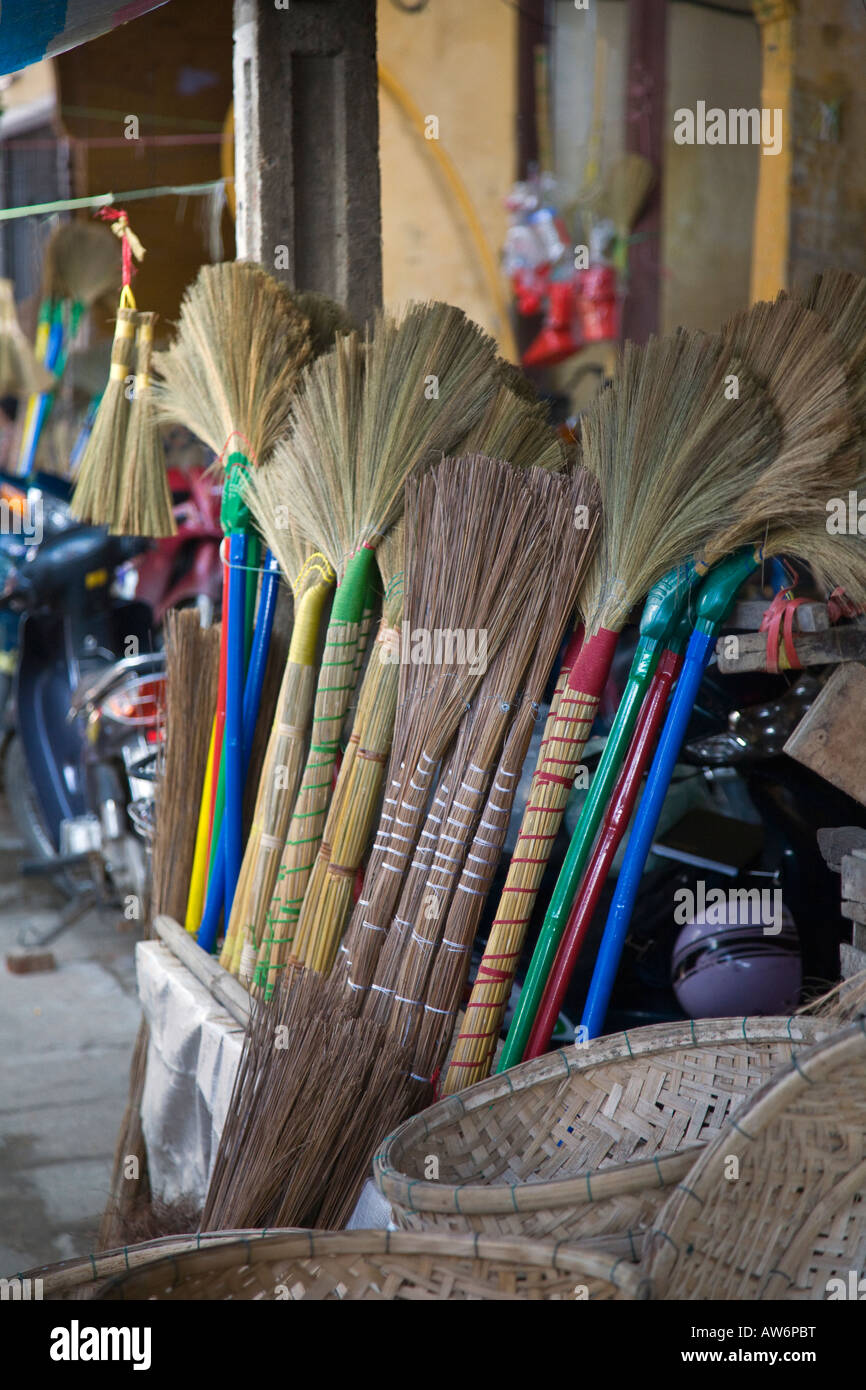 HANDMADE BROOMS await sale in the village of HOI AN VIETNAM Stock Photo