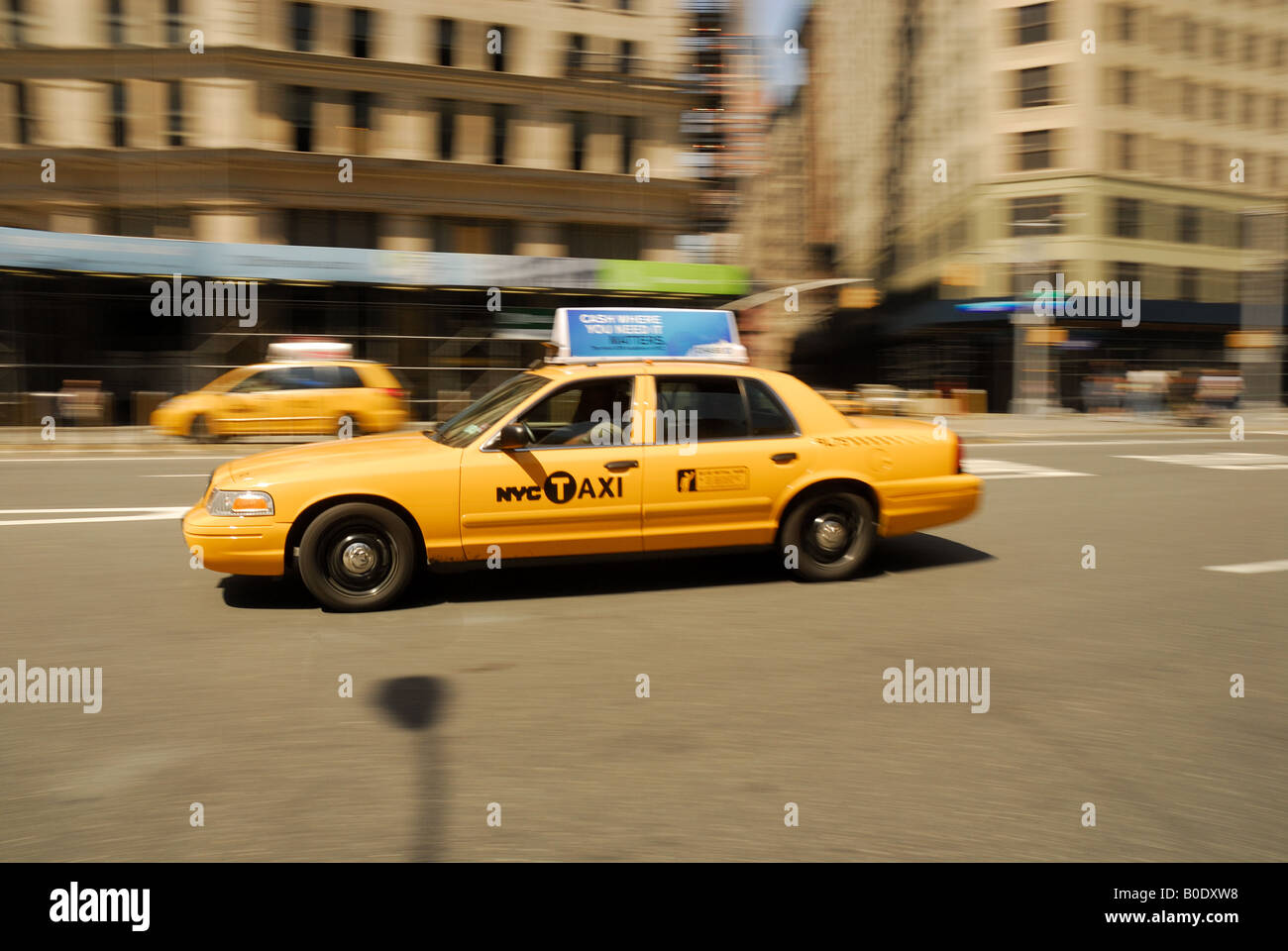 Yellow Taxi rushing  through New York City Stock Photo