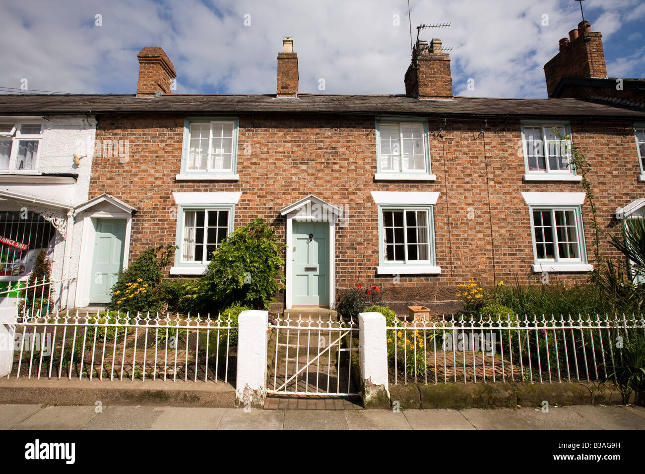 UK Cheshire Tarporley High Street terraced houses with small front gardens Stock Photo