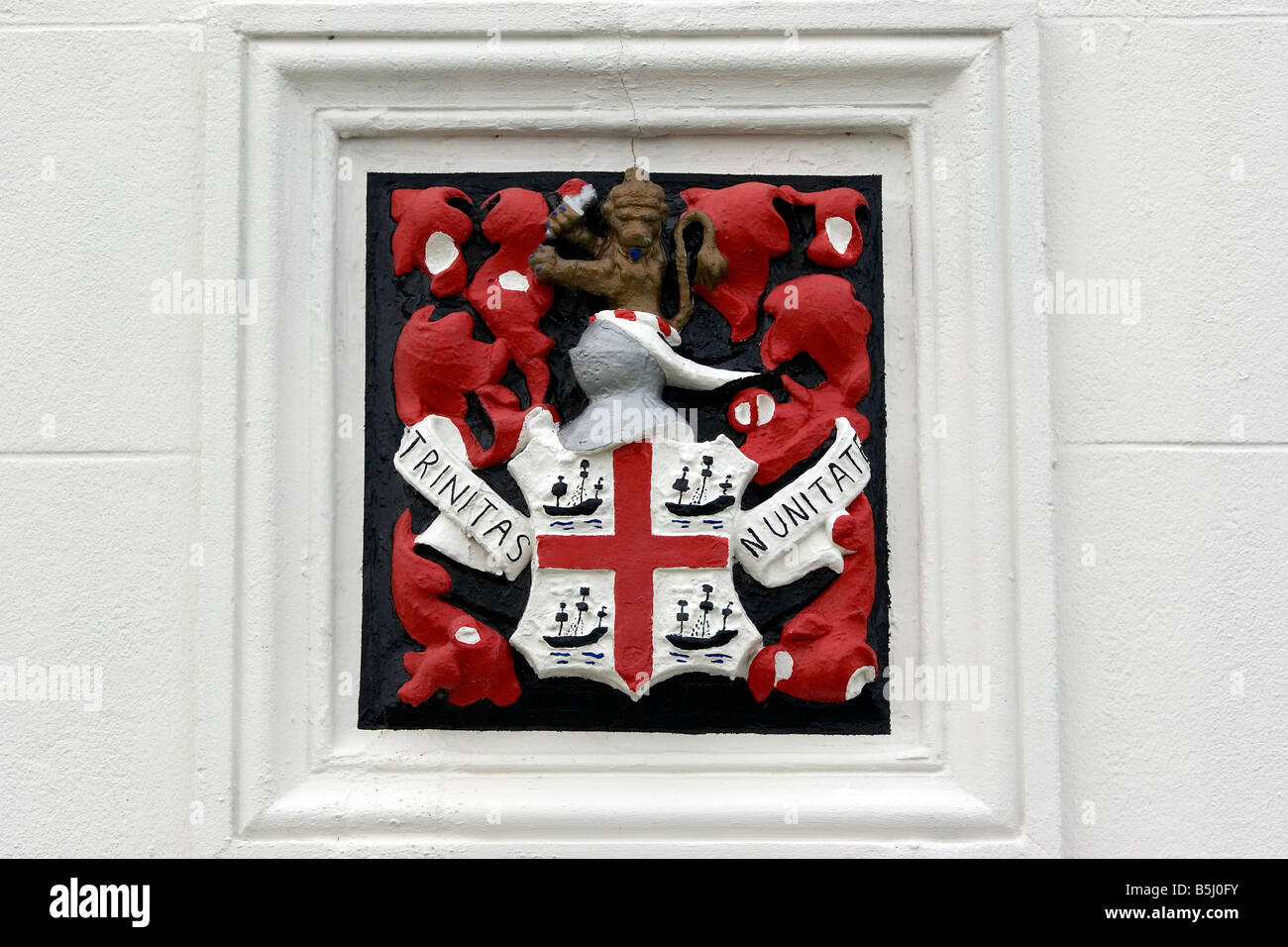 Badge on Hurst Lighthouse  Hampshire with the latin inscription Trinitas in Unitate or Three In One  ,motto of Trinty House Stock Photo