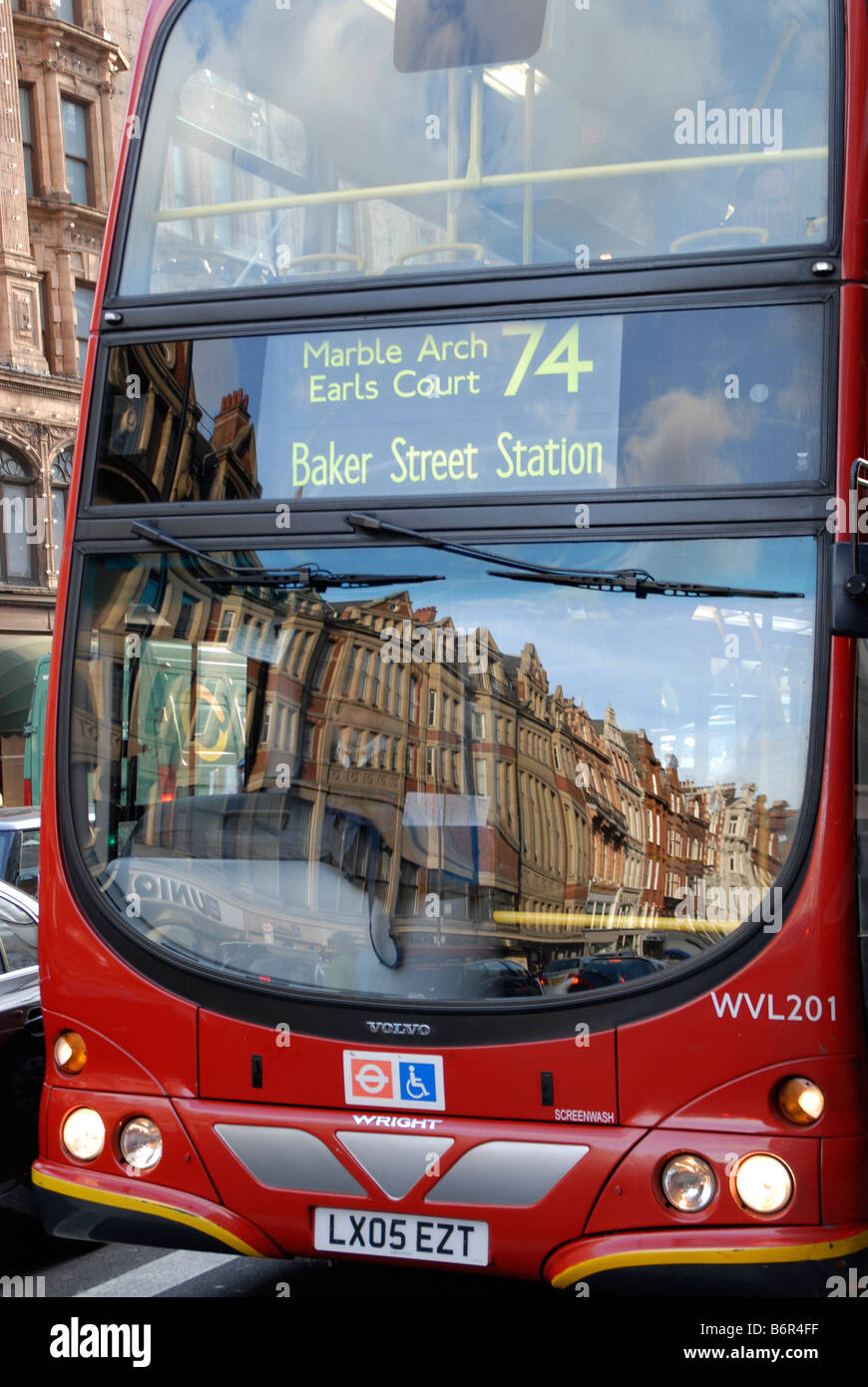 Reflection of a London, England city street in the window of a double deck bus. Stock Photo