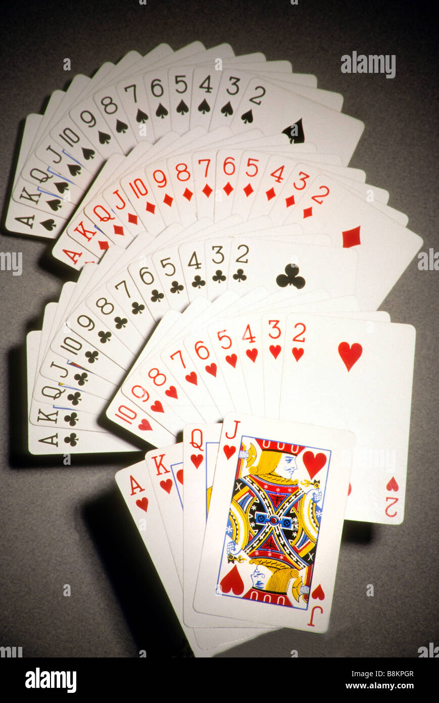 Entire deck  cards is spread out by suit and number Stock Photo