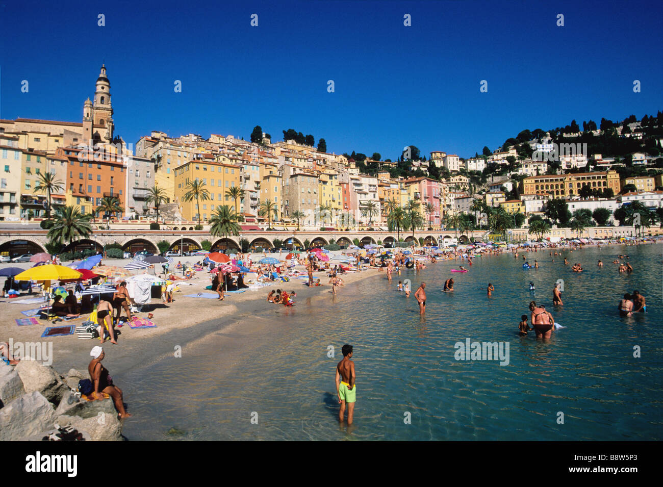 Beach of Les Sablettes beneath the old town of Menton Stock Photo