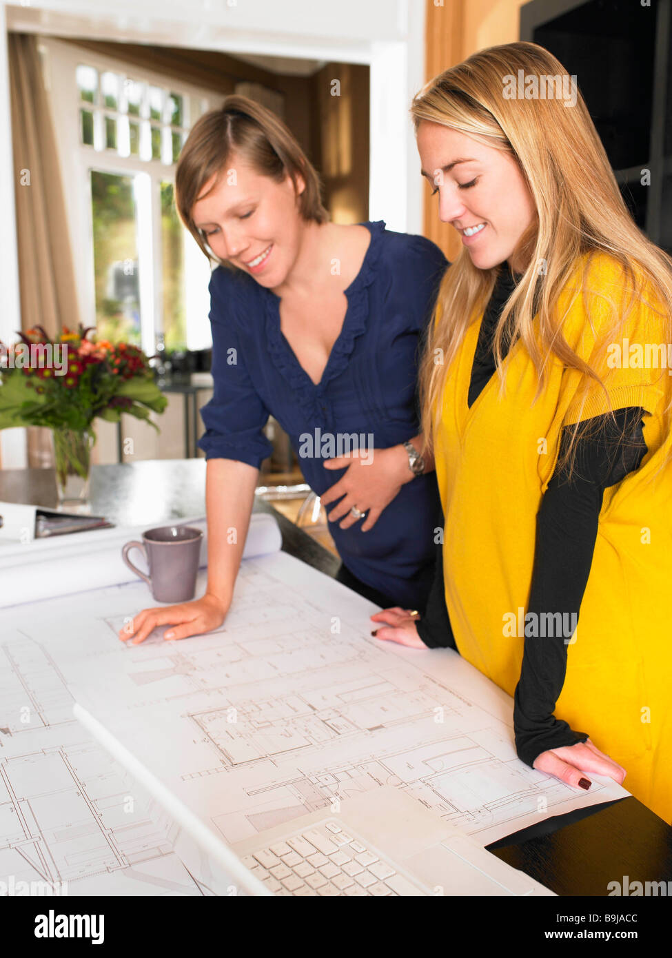 Pregnant women at work Stock Photo