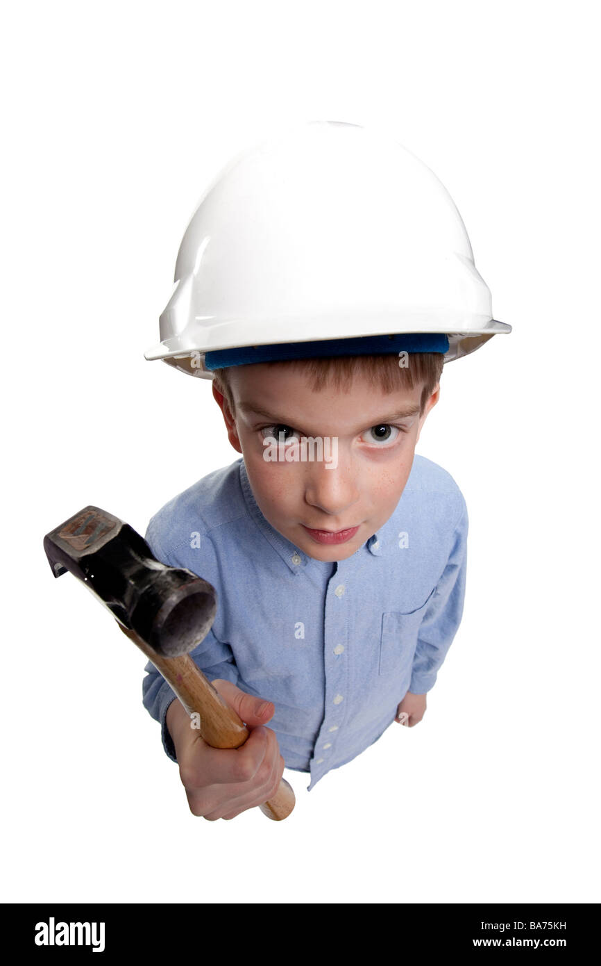 young boy wearing hard hat and holding a hammer Stock Photo