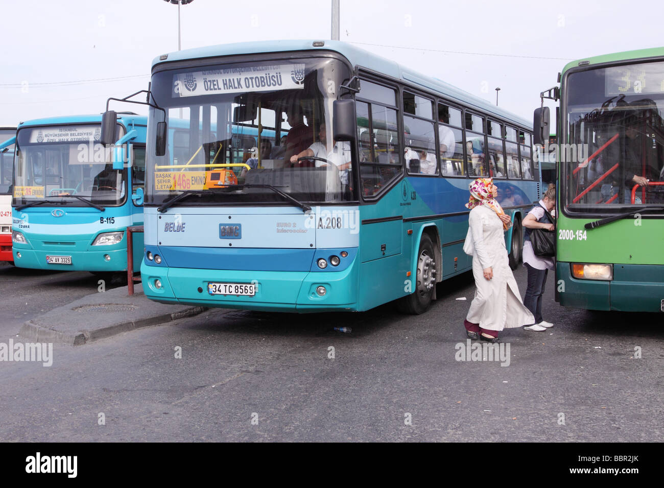 Istanbul Turkey Turkish woman dressed in Muslim clothing boards a bus ...