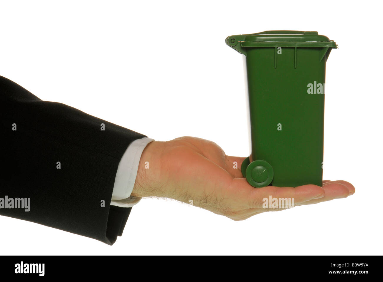 Manager's hand holding a garbage bin Stock Photo