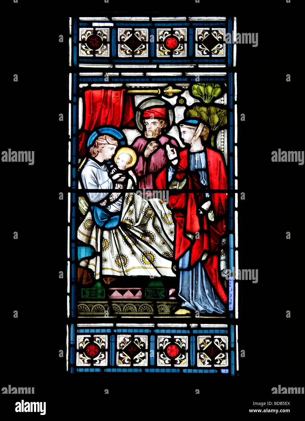 Stained Glass Window by Bell & Almond depicting Luke 1 57 Birth of Saint John the Baptist Earls Barton Church Northamptonshire Stock Photo