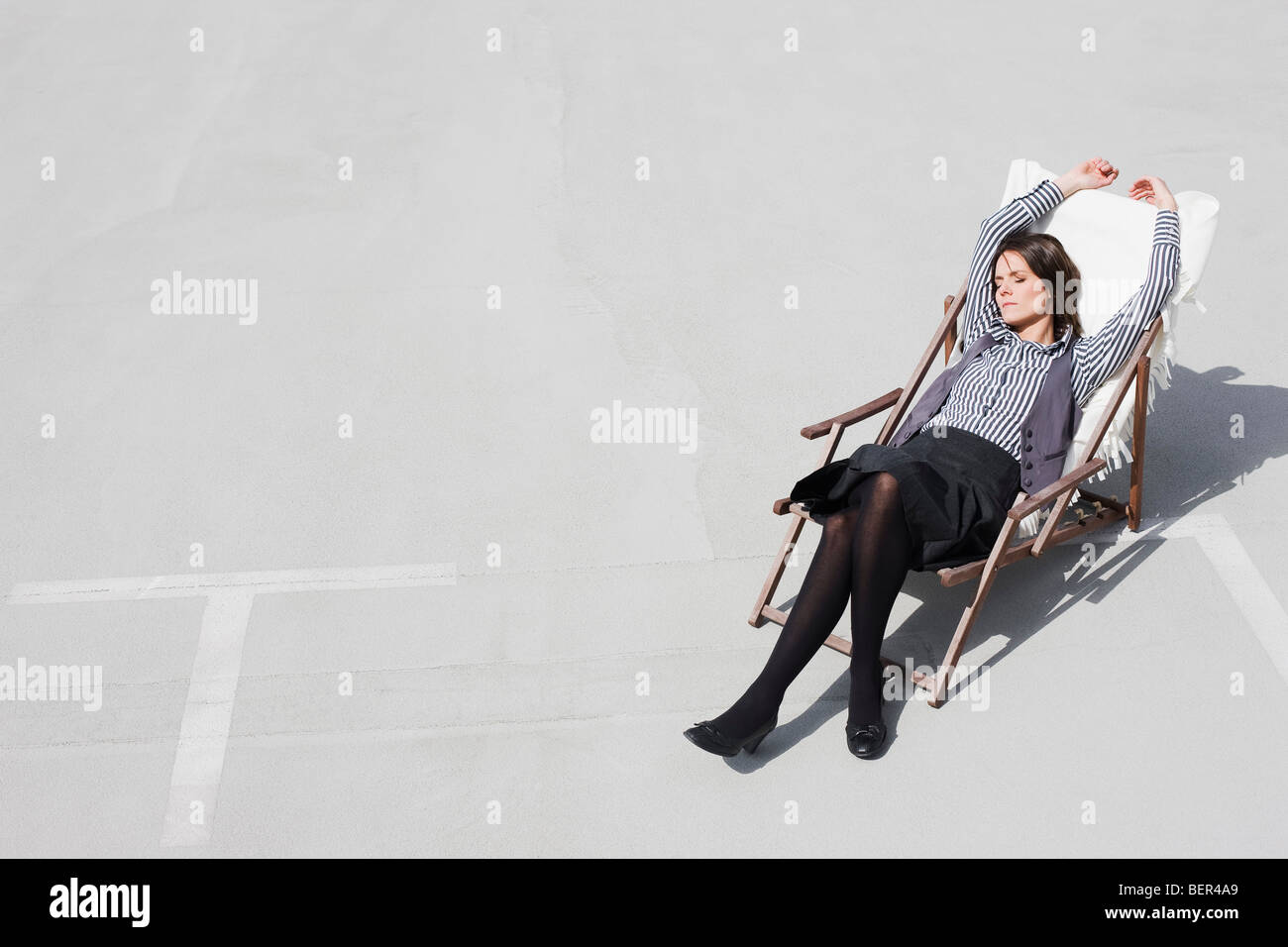 woman relaxing in deck chair Stock Photo