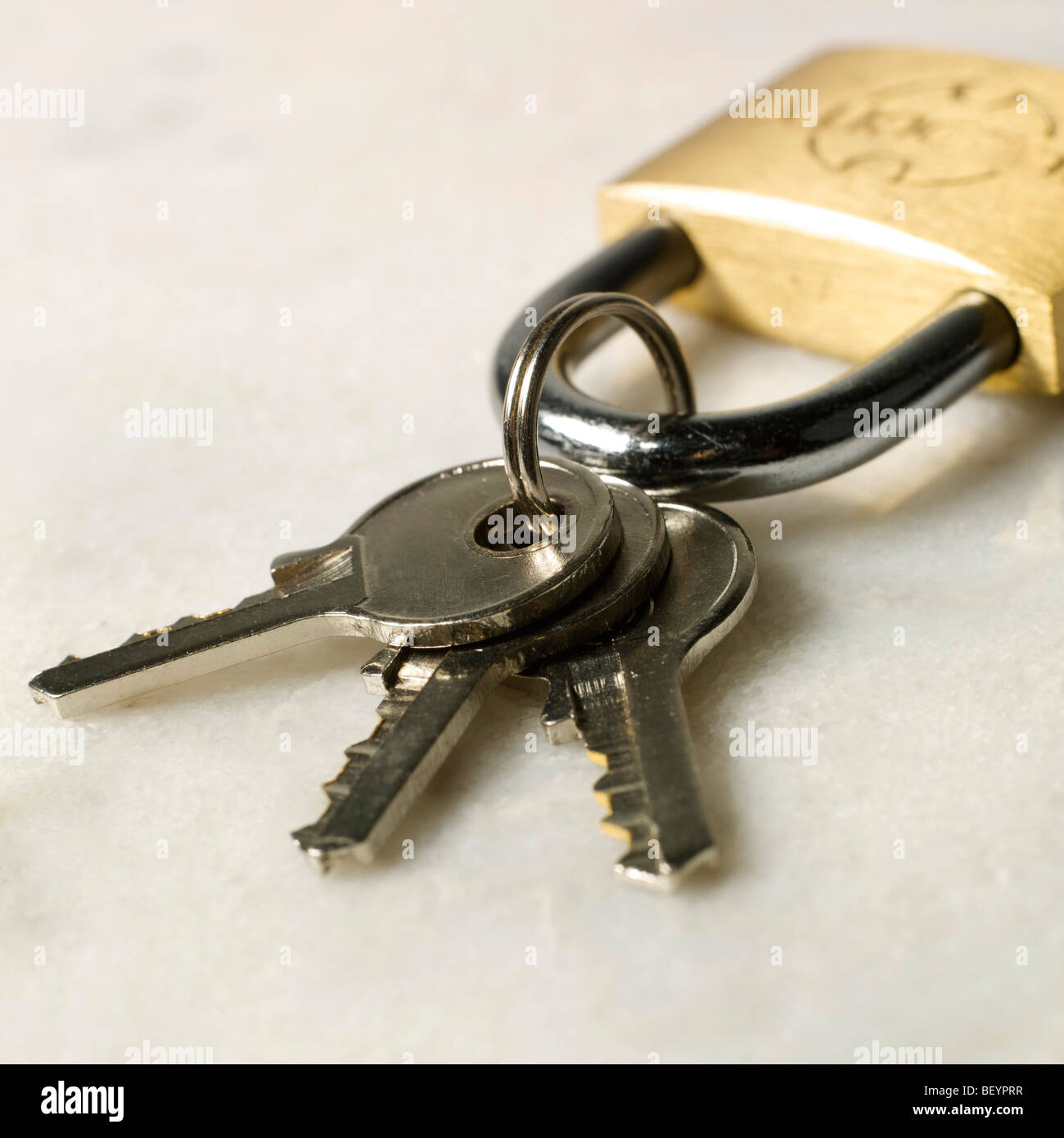 Padlock with three keys. Stock Photo