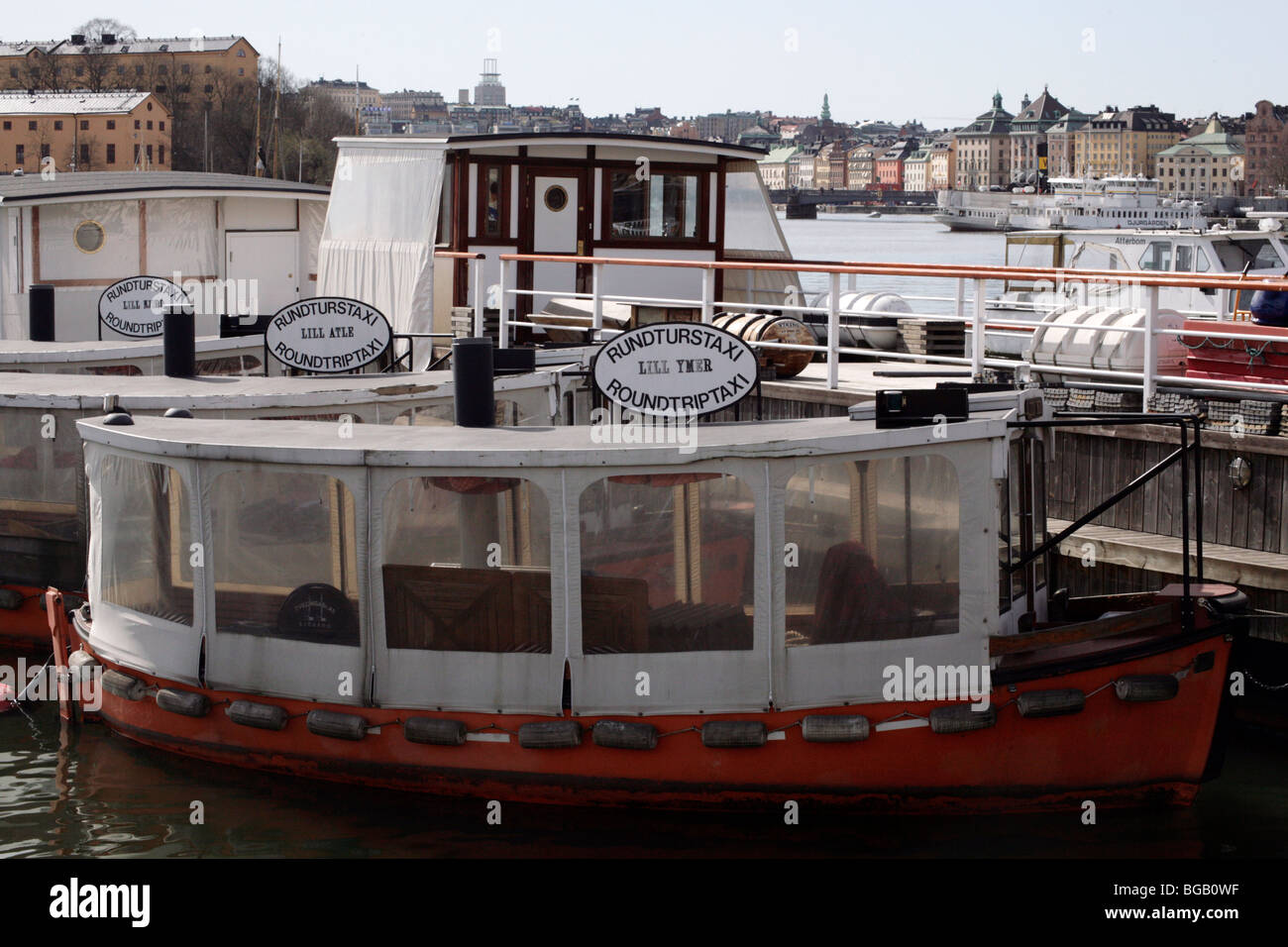 OLD FASHIONED BOAT TAXI, STOCKHOLM HARBOUR: Riverboat boat taxi parked at Djurgarden opposite Gamla Stan Old Town Stockholm Sweden Stock Photo