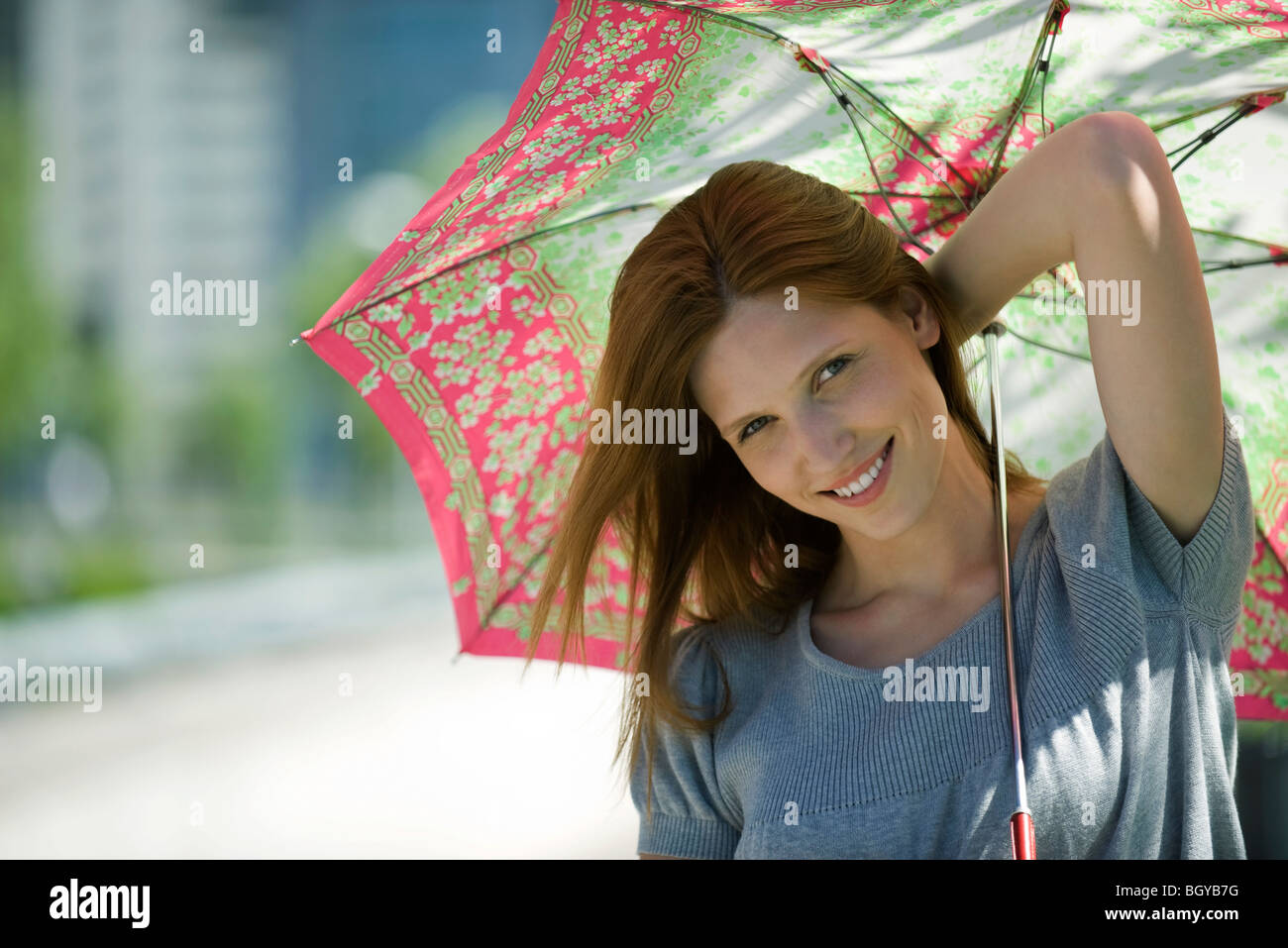 Young woman with parasol Stock Photo