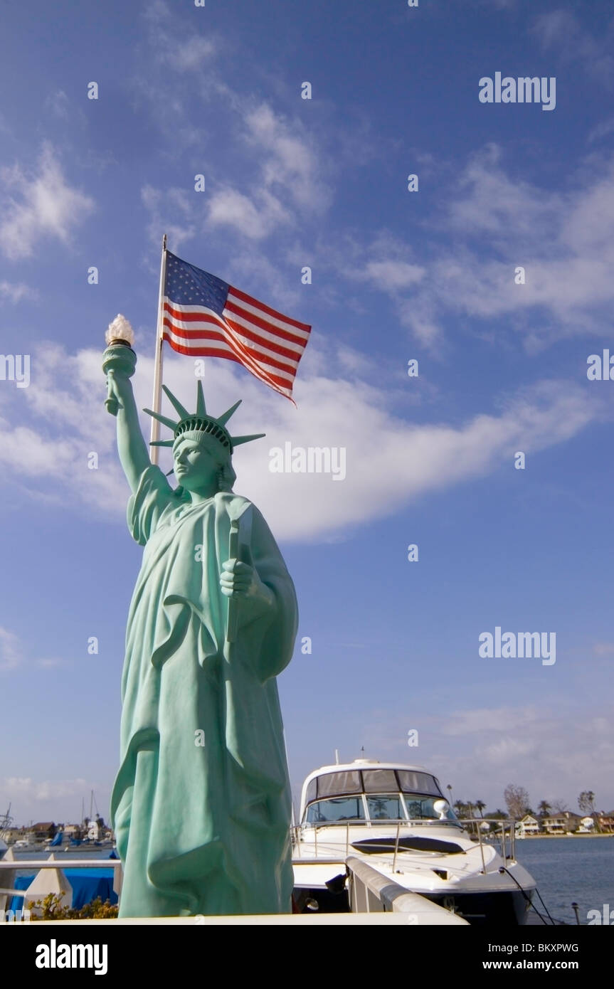 A replica of the Statue of Liberty is among the whimsical sculptures found on Balboa Island in Newport Harbor at Newport Beach in California, USA. Stock Photo