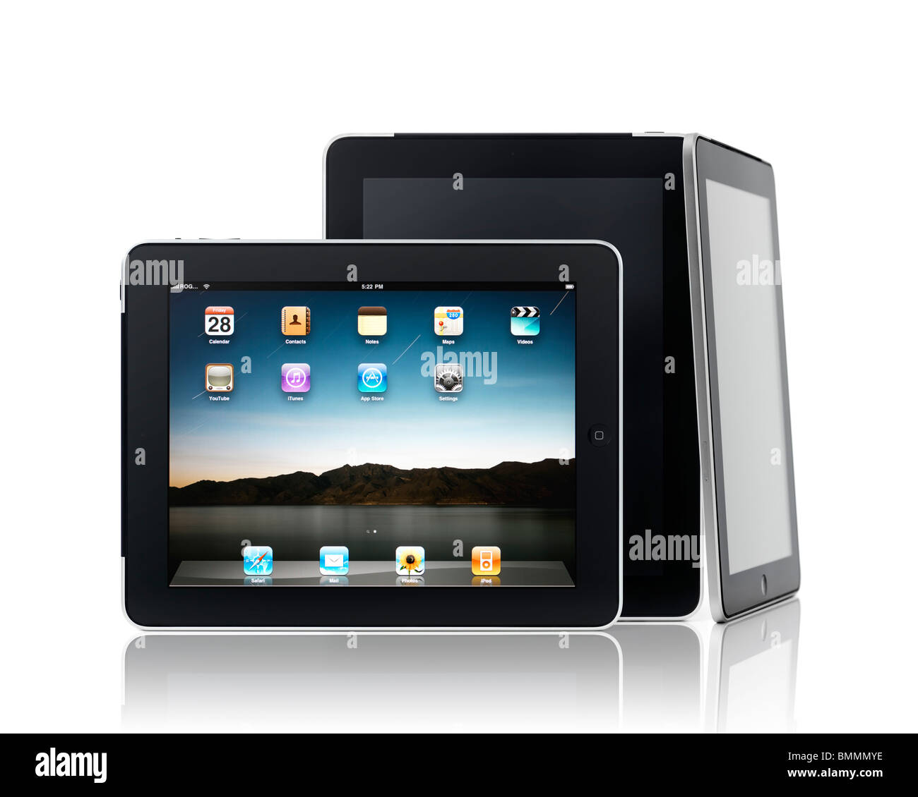 Three Apple iPad 3G tablet computers in a composition isolated on white background Stock Photo