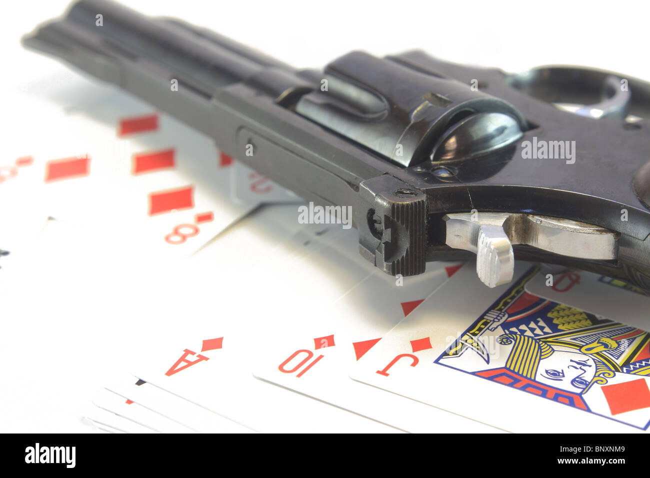 gun and playing cards Stock Photo