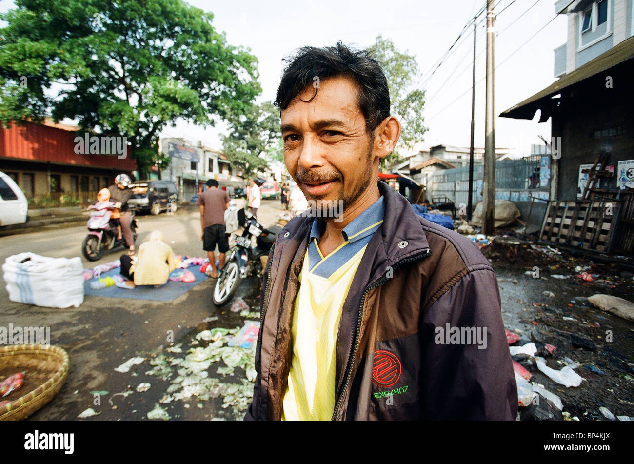 middle age poor man at traditional market Indonesia Stock Photo