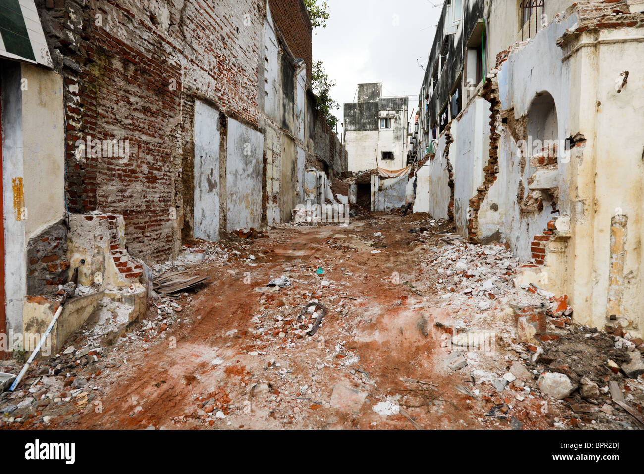 Street with ruins of demolished houses. Chennai, India Stock Photo