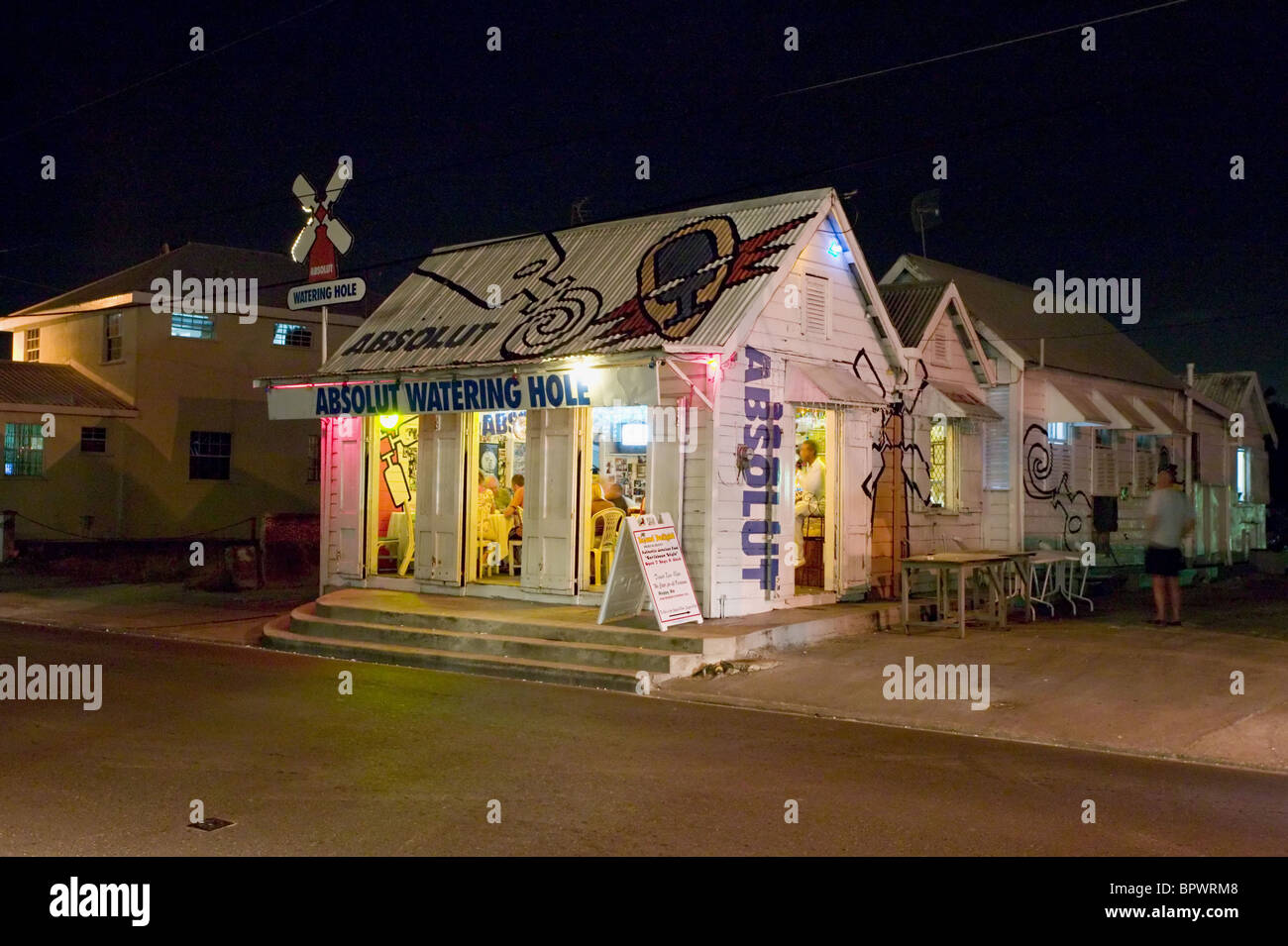 Rum Shop lit up at night in St Lawrence in Barbados in the Caribbean Island Stock Photo