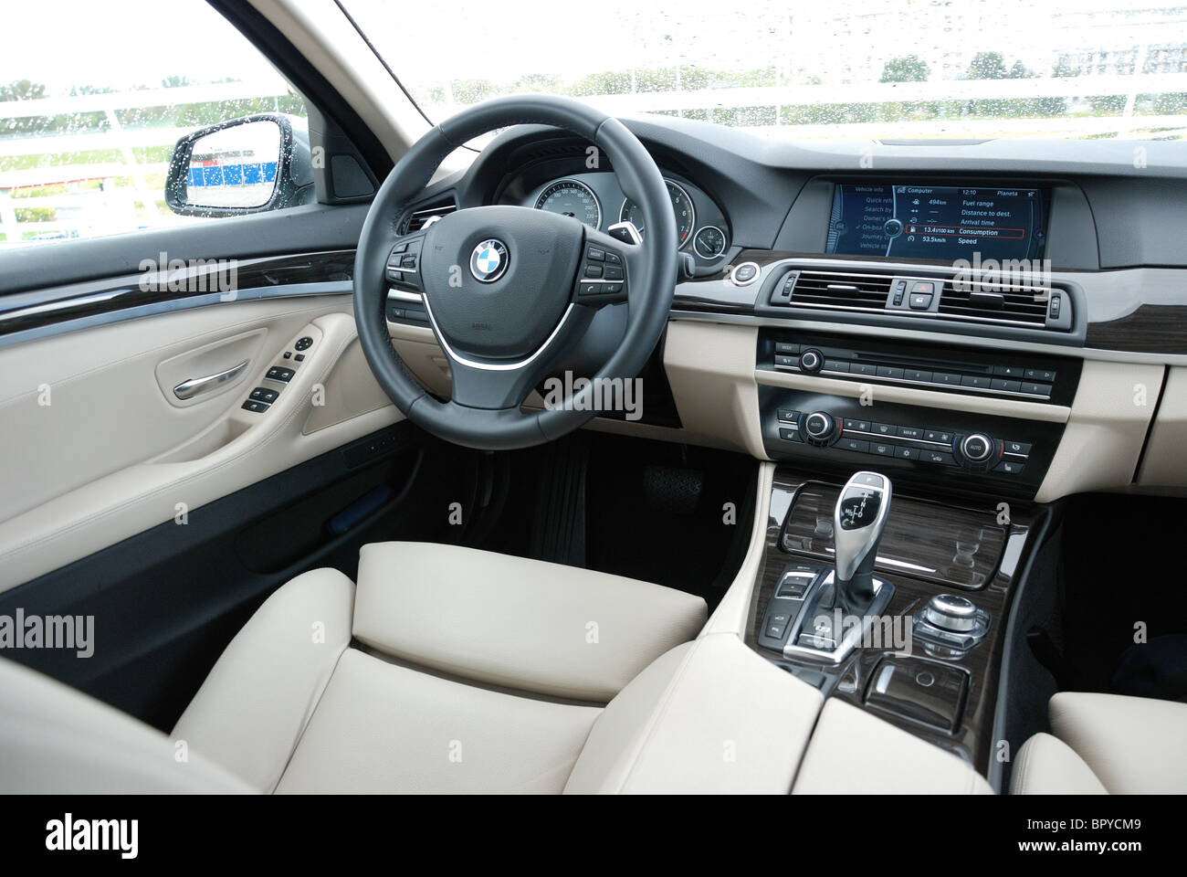 BMW 535i - MY 2010 - grey metallic - German premium higher class sedan, segment E (executive) - interior, driver's place, cabin Stock Photo