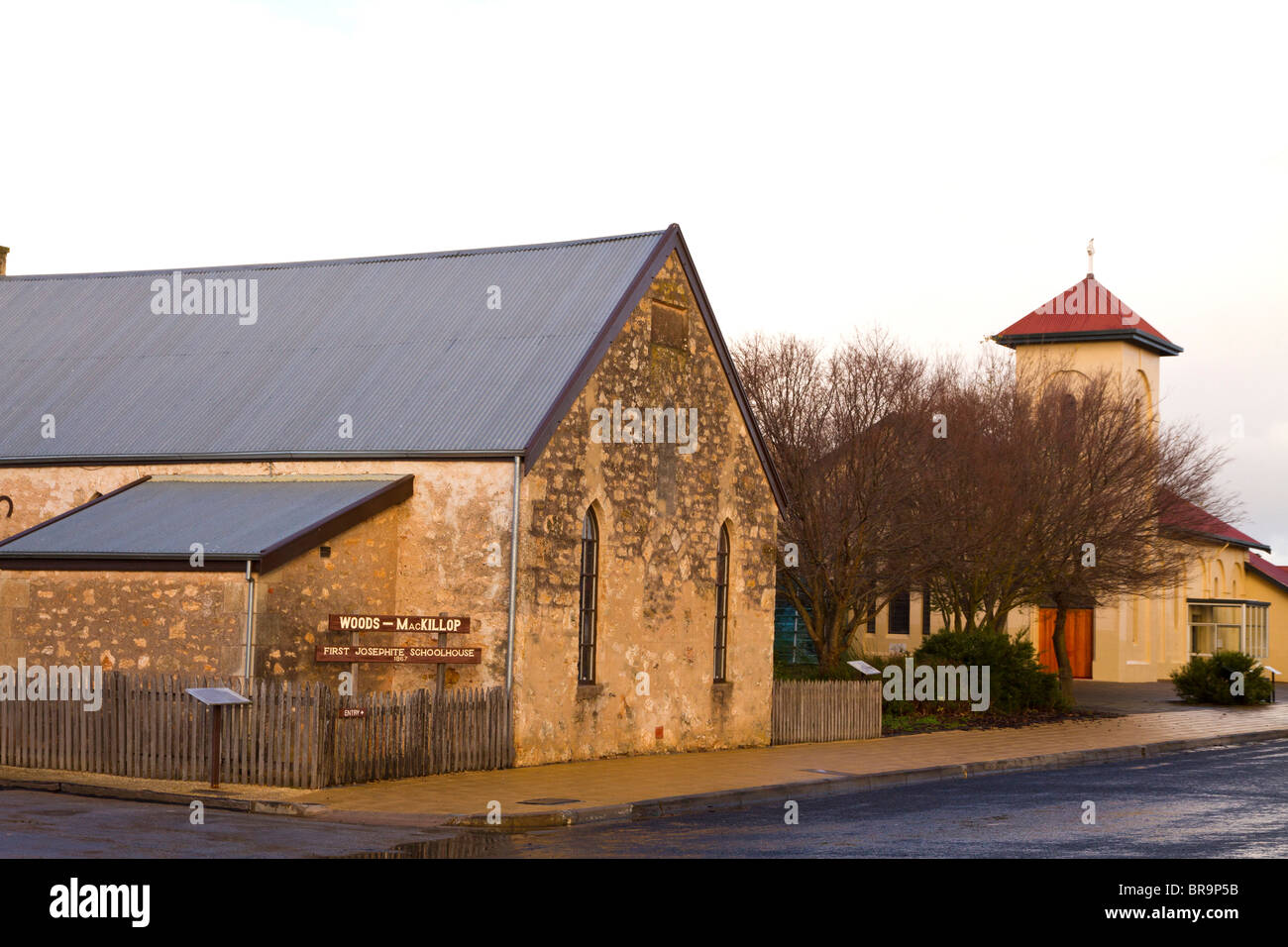 The Woods-MacKillop Schoolhouse in Penola South Australia where Mary MacKillop taught. St Josephs church is shown on the right Stock Photo