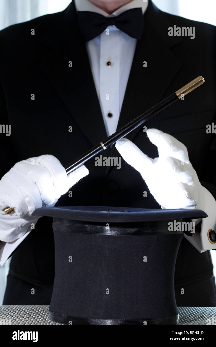 Magician Performing with Top Hat and Wand Stock Photo