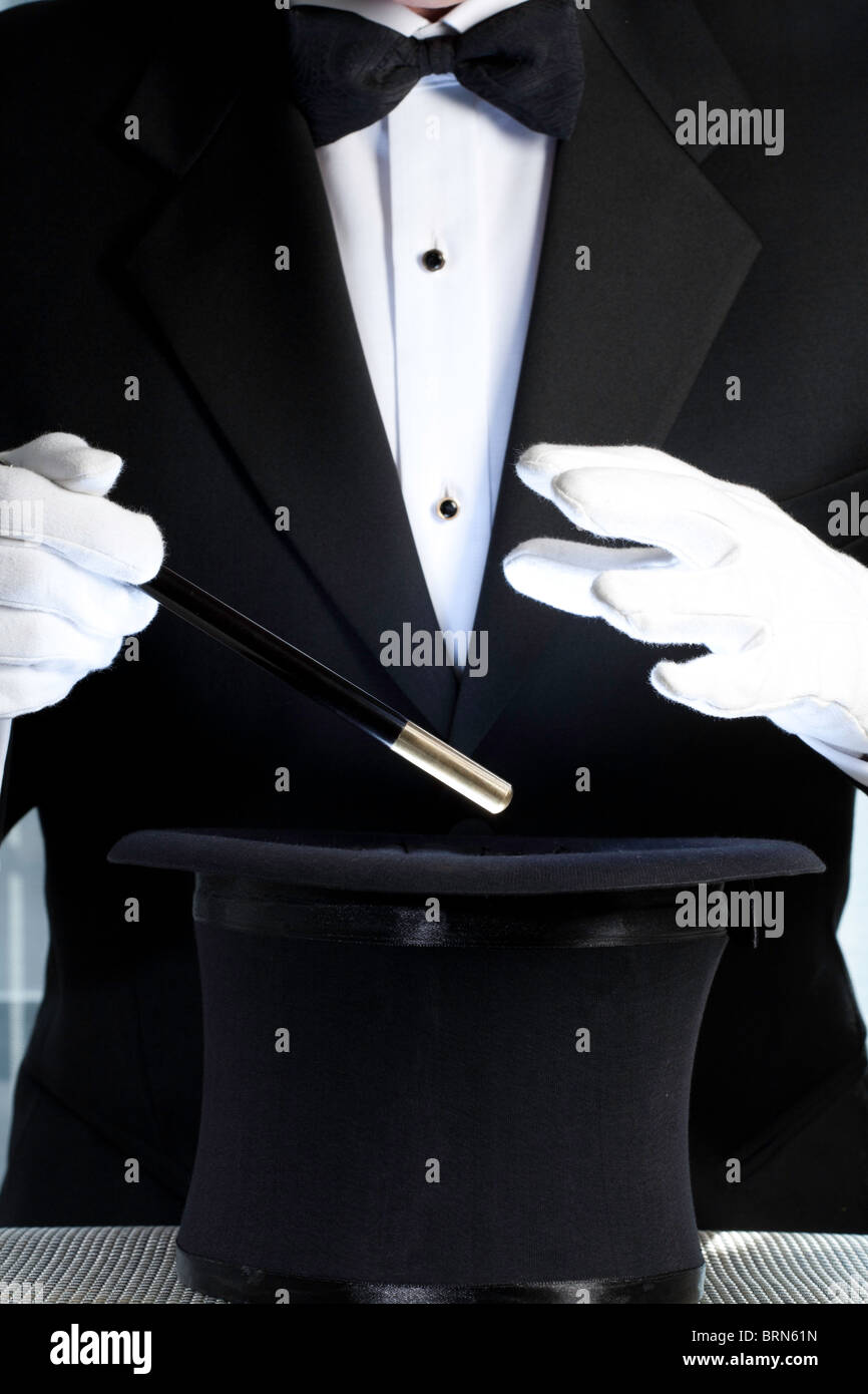 Magician Performing with Top Hat and Wand Stock Photo