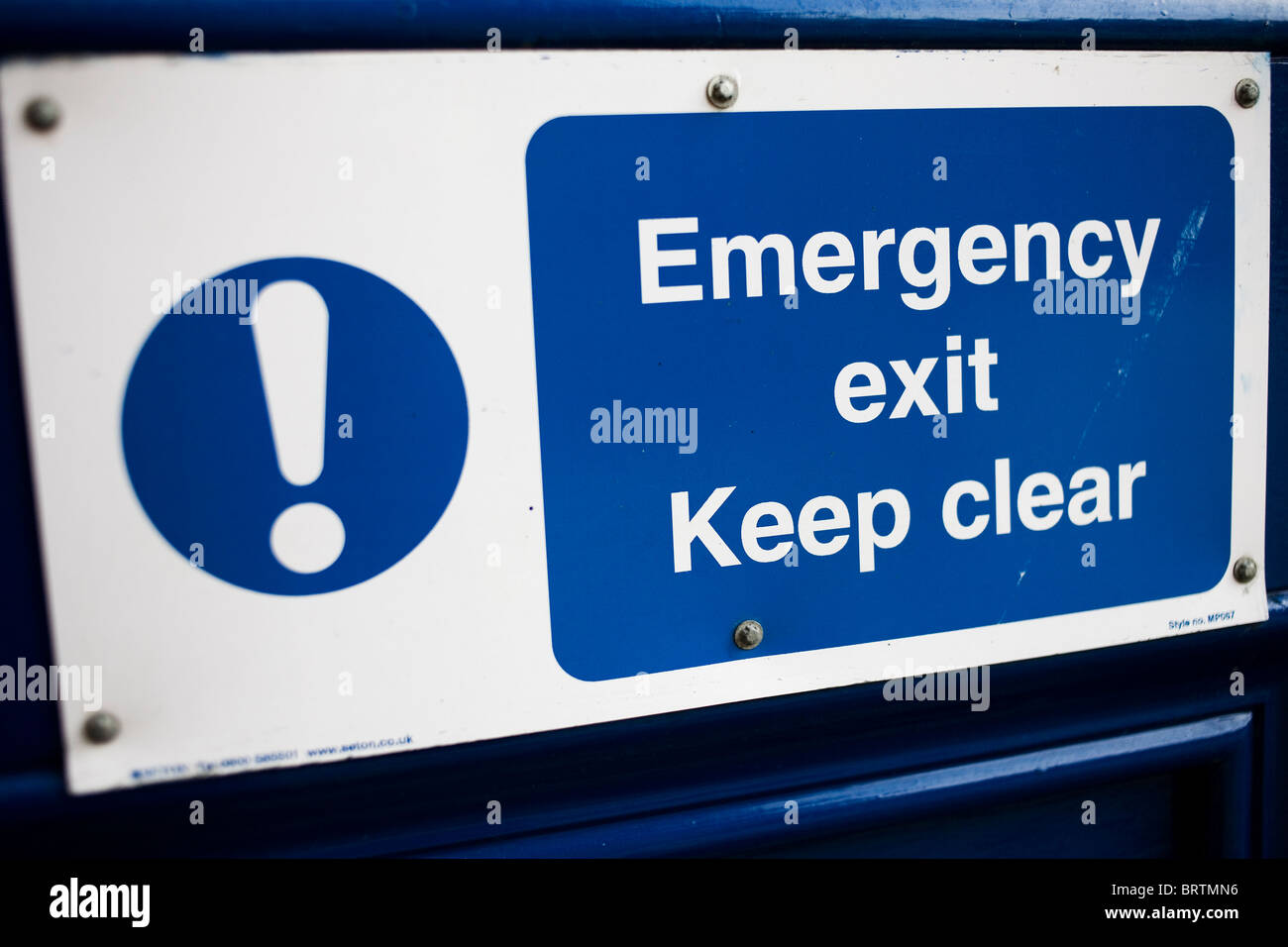 Emergency Exit Keep Clear door sign. Stock Photo