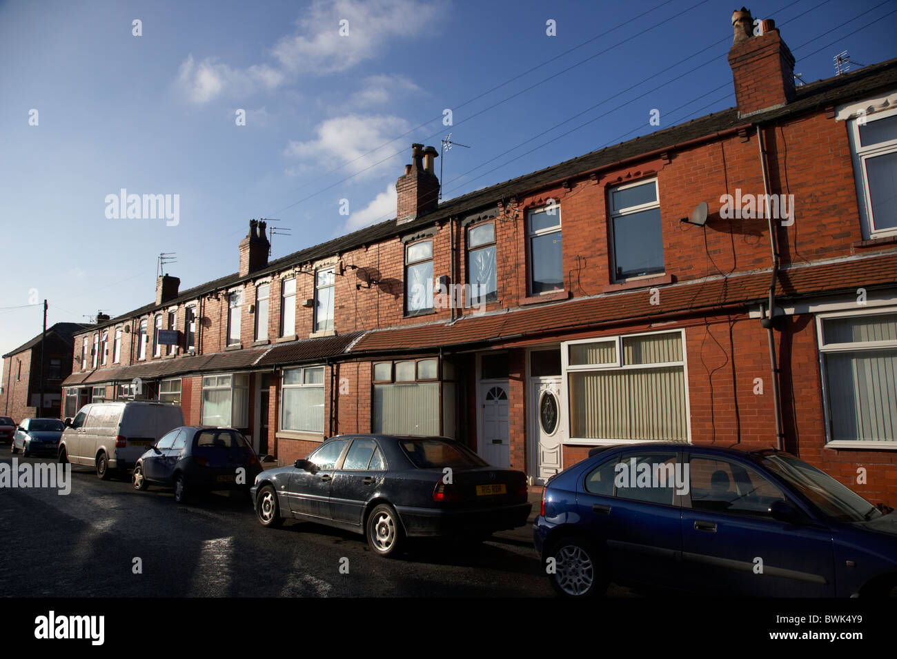 row of 2up 2down modernised victorian red brick terraced houses in manchester uk Stock Photo