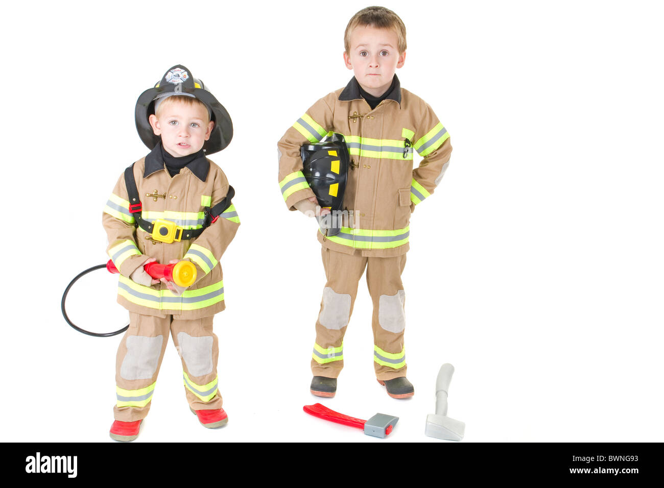 little boys imagination dress up as patriotic  fire fighter and rescue heros Stock Photo