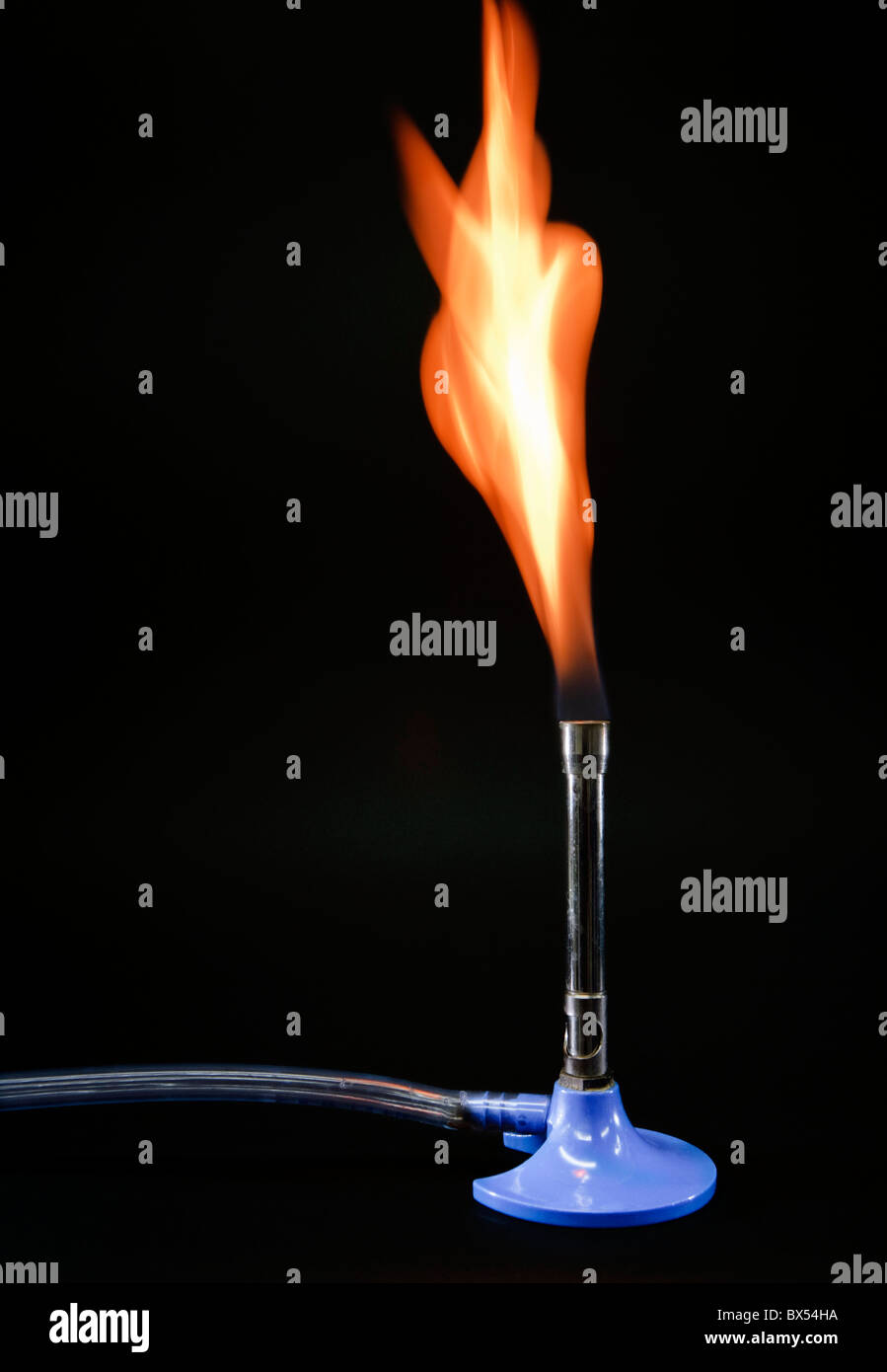 Lit Bunsen burner Stock Photo