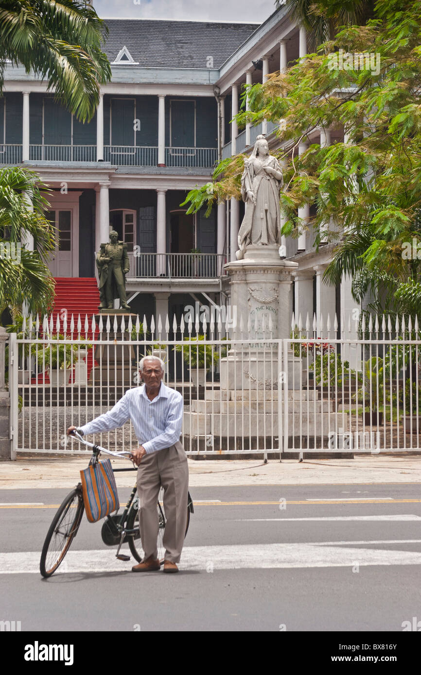 Cyclist in front of Government House Port Louis Mauritius Stock Photo