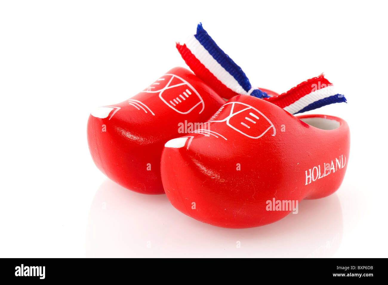 Red Dutch wooden clogs isolated over white Stock Photo