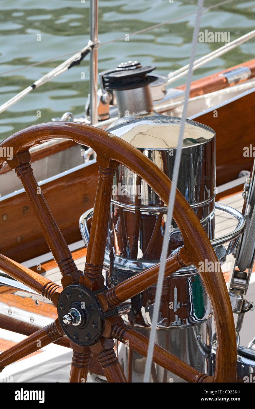 Detail of an old-fashioned boat deck with rudder Stock Photo