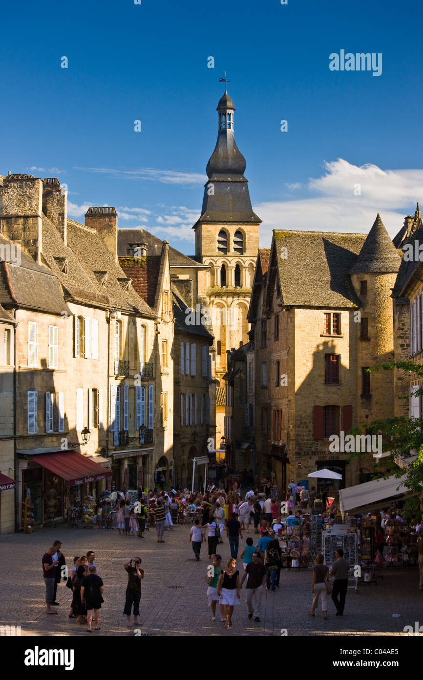 Centre Ville, tourists in town square of popular picturesque tourist destination of Sarlat in the Dordogne, France Stock Photo