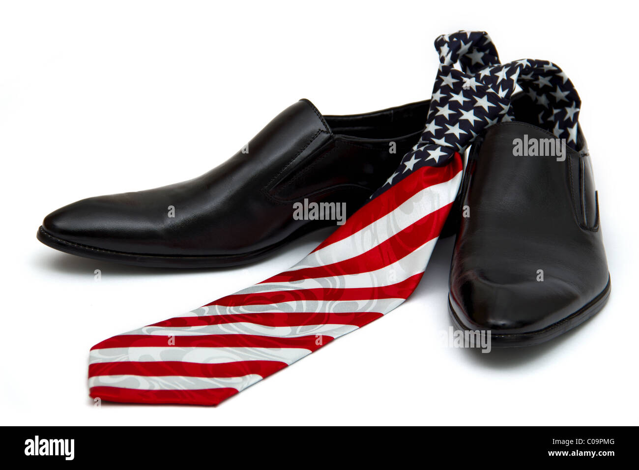 Black man's shoes and necktie with a coloring in style of a flag of America, on the white background, isolated Stock Photo