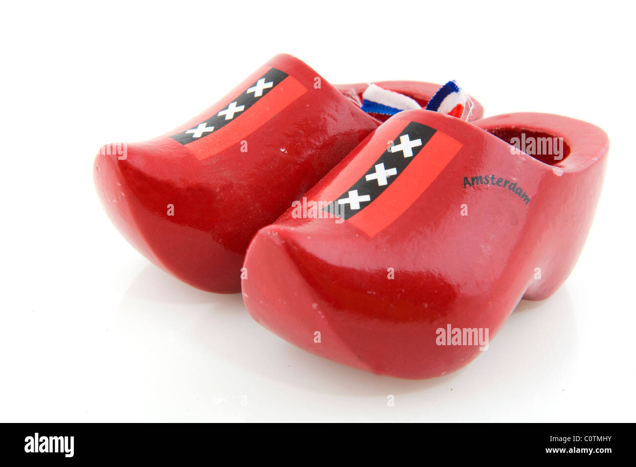 Dutch clogs from Amsterdam in red with flag ribbon Stock Photo