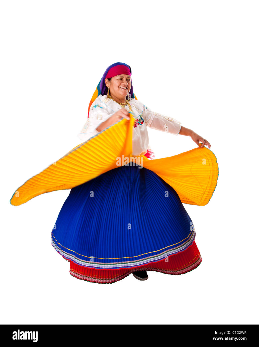 Latin Gypsy woman from South America dressed in Folklore clothes from Ecuador, Colombia, Bolivia or Venezuela, dancing twirling. Stock Photo