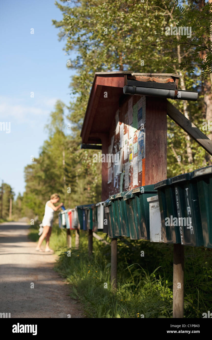 Row of garbage bins by road Stock Photo