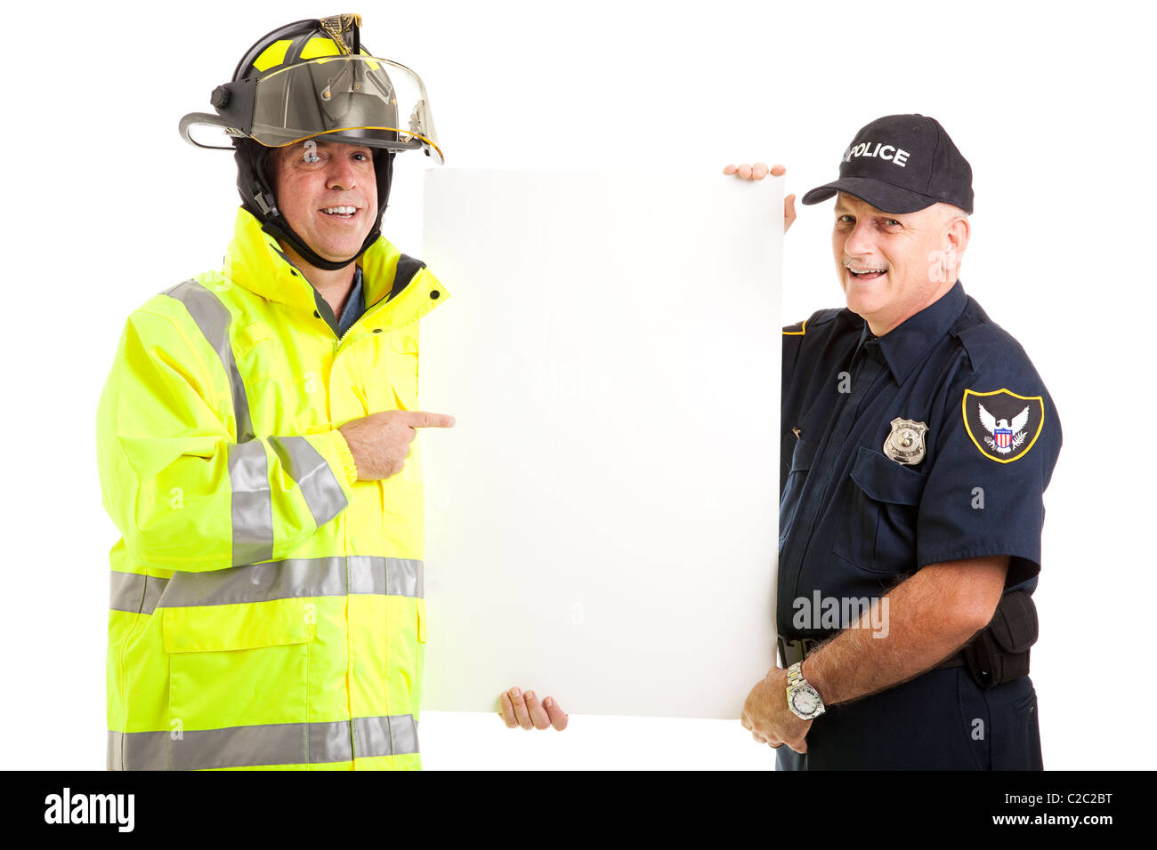 Firefighter and Policeman holding a blank white sign. Isolated on white.  Stock Photo